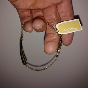 MICHAEL KORS GOLD HORN BRACELET.